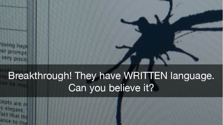 Screenshot of an in-fiction document showing a circular heptapod logoglyph from the film Arrival, with the caption 'Breakthrough! They have WRITTEN language. Can you believe it?'