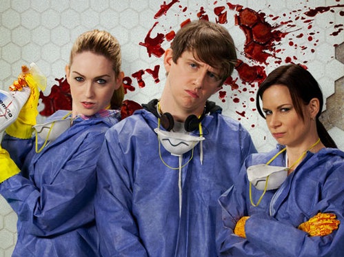 Promotional image for Dirty Work, showing the main cast in cleaning suits in front of a title treatment, with Jaime Clayton as Michelle, Hank Harris as Pete, and Mary Lynn Rajskub as Roxy.